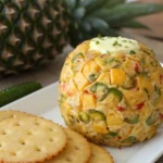 A delicious plate of Pineapple Jalapeno Firecracker New Year’s Cheese Ball