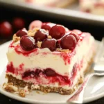 A delicious plate of Layered Cherry Cheesecake Lush Dessert Recipe